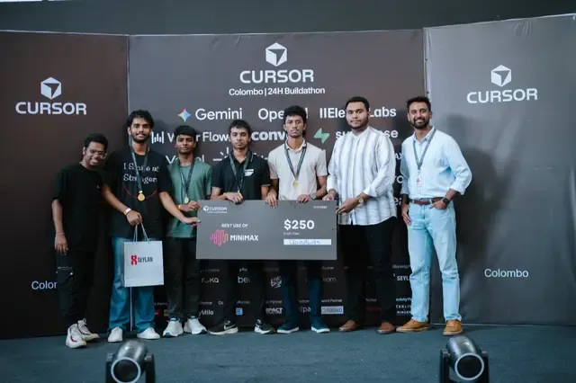 Team on stage at Cursor Colombo holding a Best Use of MiniMax prize check